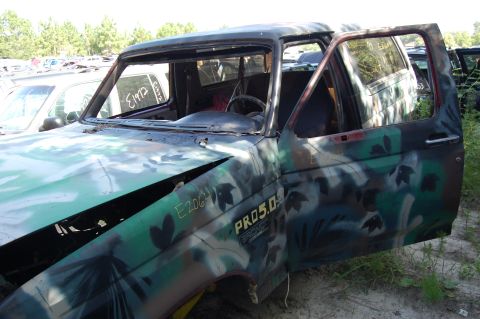 1994 Ford Bronco - This camouflaged Ford Bronco shows "PRO 5.0" badging on its fender.