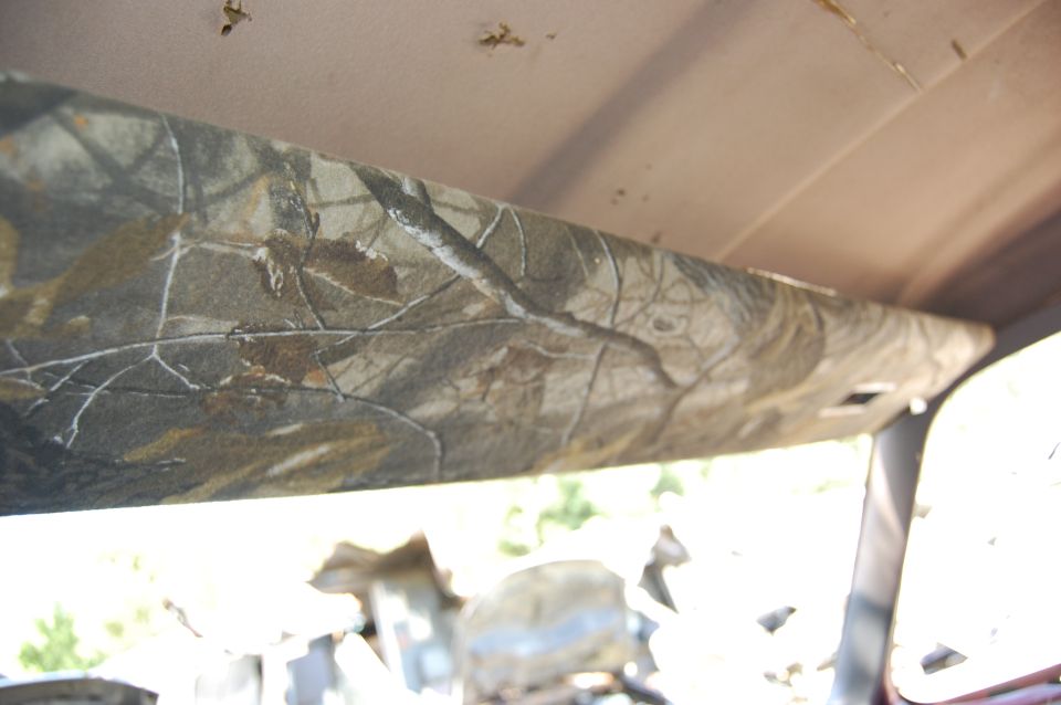 Camouflage headliner inside vehicle interior