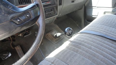 1989 Ford Bronco - Interior view of a 1989 Ford Bronco, highlighting the manual transmission and 4x4 controls.