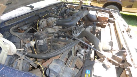 1989 Ford Bronco - Engine bay of a 1989 Ford Bronco, showing the V8 engine and associated components.