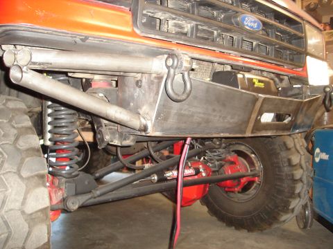 1989 Ford Bronco - Custom front bumper and suspension details on a Ford truck, likely from the early 1990s.