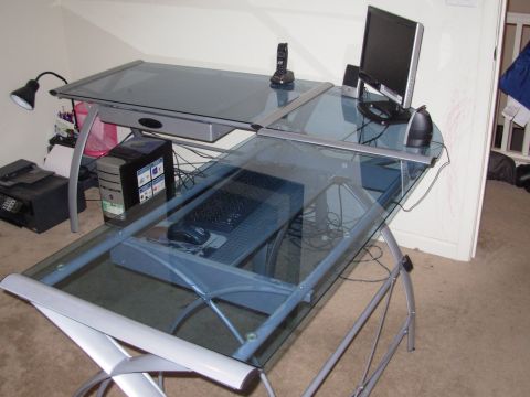 1995 Ford Taurus - Glass computer desk setup with monitor, tower, keyboard, mouse, and printer visible.