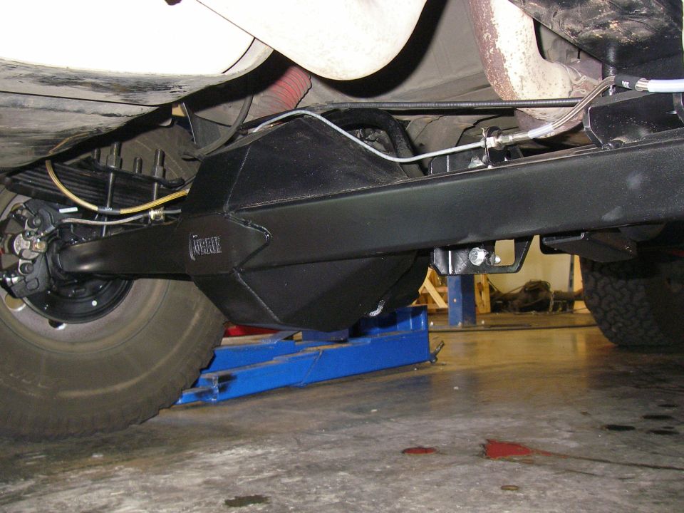 Black Currie 9-inch rear axle installed under leaf-sprung frame on jack stands