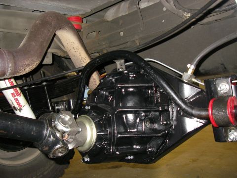 1990 Ford Bronco - Close-up of a vehicle's rear differential and suspension system, showing aftermarket parts.