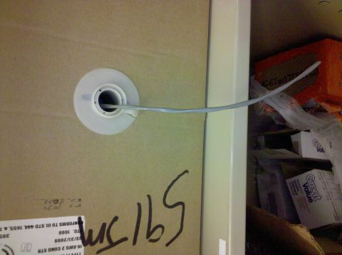 2001 Ford F-150 - A cardboard spool with a cable is visible, along with some boxes in the background.
