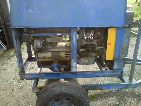1994 Ford F-150 - This portable generator is mounted on a trailer, showing its internal engine and electrical components.