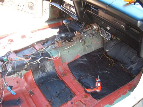 1973 Ford Ranchero - The interior of a 1973 Ford Ranchero shows exposed wiring and flooring during a restoration project.