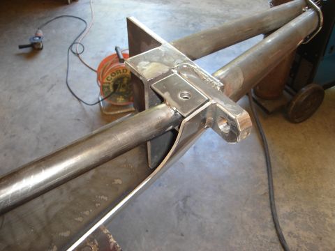 1989 Ford Bronco - Close-up of a custom-fabricated bumper section, showing metalwork and welding in a workshop setting.