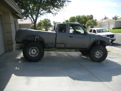 1997 Ford Ranger - Modified 1997 Ford Ranger pickup truck parked in a driveway, with another truck behind it.