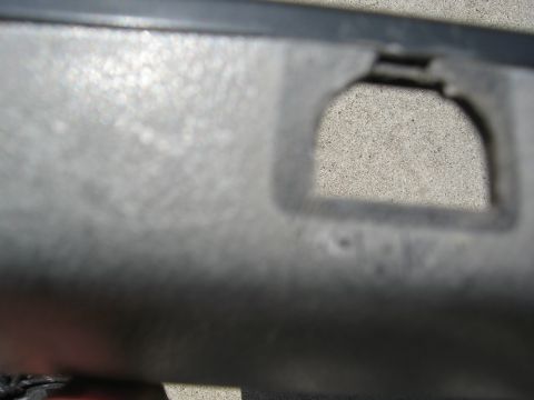 1986 Ford Bronco - Close-up of a vehicle's interior door panel, showing texture and a cutout.