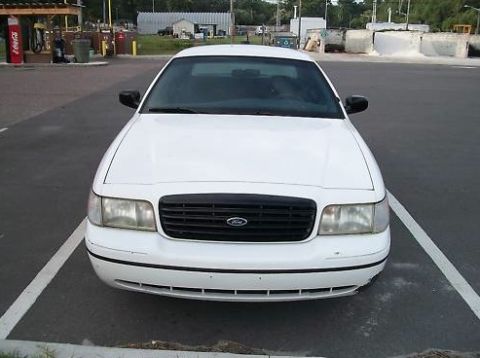 1999 Ford Crown Victoria - Front view of a white 1998 Ford Crown Victoria parked in a lot.