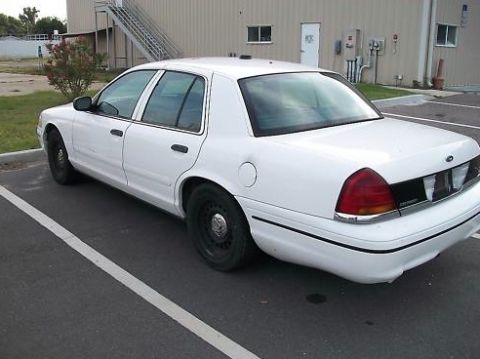 1999 Ford Crown Victoria - This 1999 Ford Crown Victoria is seen from the rear three-quarter angle in a parking lot.