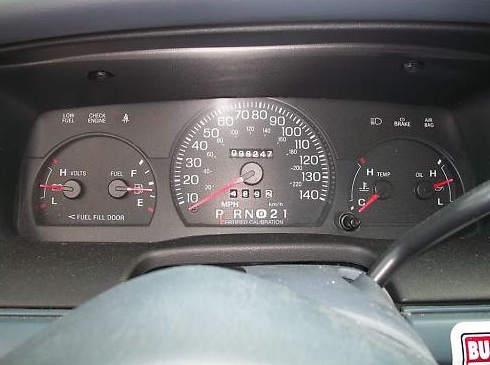 1999 Ford Crown Victoria dashboard gauges showing 99,847 miles and 0092 hours