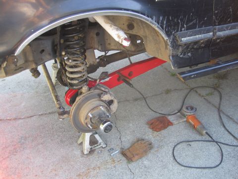 1989 Ford Bronco - Vehicle suspension work in progress, showing brake assembly and suspension components.