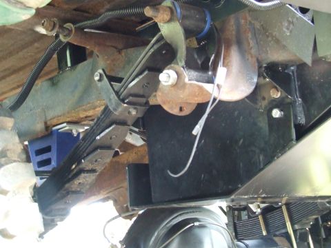 1976 Ford Bronco - Close-up of vehicle's rear suspension and fuel tank assembly, with Supermotors.net watermark.