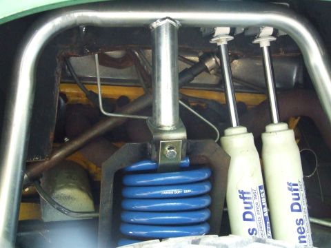 1976 Ford Bronco - Vehicle suspension components including blue coil springs and Duff shock absorbers are visible.
