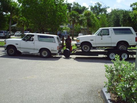 1995 Ford Bronco - A 1995 Ford Bronco is towed by another 1995 Ford Bronco on a trailer.
