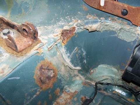 1989 Ford Bronco - Significant rust damage is visible on the vehicle's metal components.