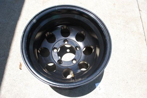 1996 Ford Bronco - A single black steel wheel with a common five-lug pattern is shown.
