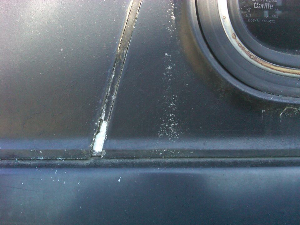 Interior dashboard crack near gauge with 'Carlite' text visible