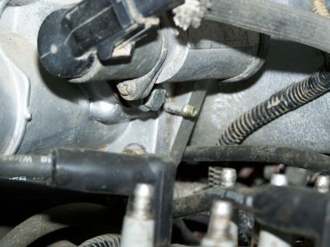 1989 Ford Bronco - A detailed view of engine components, showing wiring and metal parts.