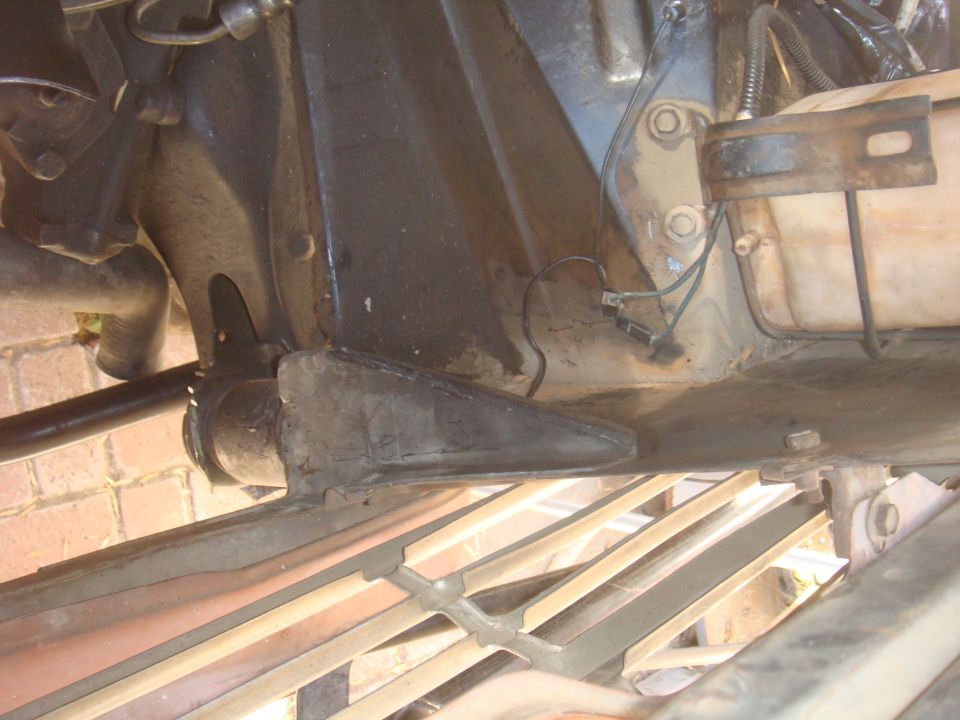 Undercarriage view of vehicle suspension components and frame