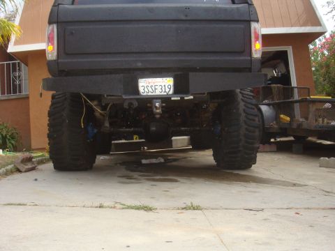 Black SUV rear with custom bumper and large tires. License plate 3SSf319