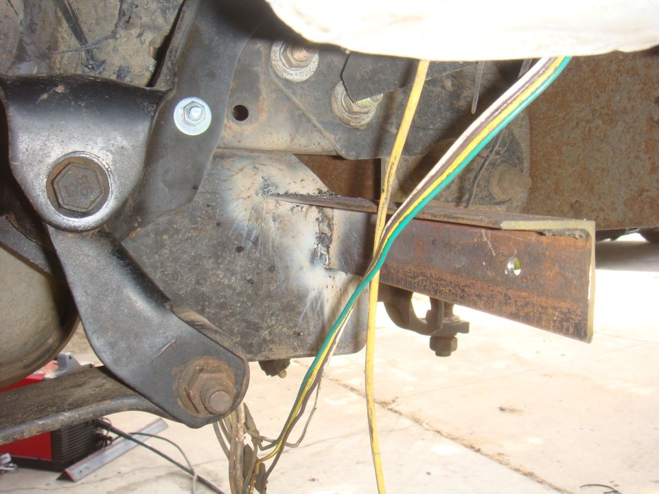Rear axle suspension components with wiring harness and trailer connector