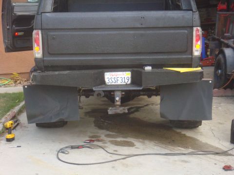Rear of a 1992 Ford Bronco with mud flaps and a trailer hitch
