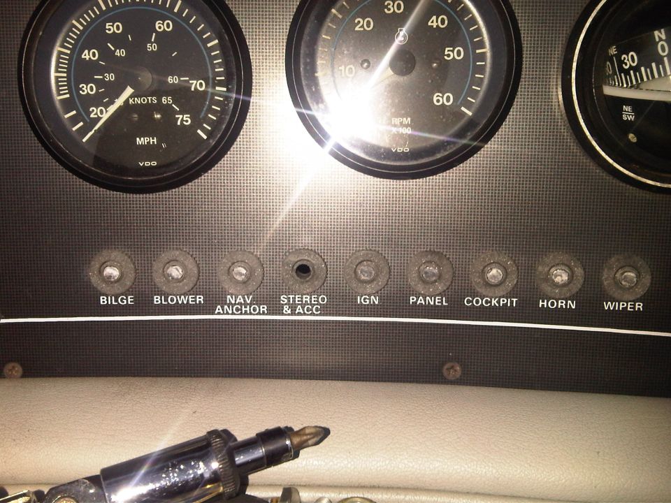 Boat dashboard with VDO gauges and labeled switches for Bilge, Blower, Nav Anchor, Stereo & Acc, Ign, Panel, Cockpit, Horn, Wiper