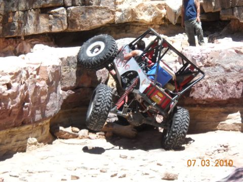 2009 Suzuki Samurai - This custom buggy navigates a rocky obstacle course, demonstrating extreme off-road capability.
