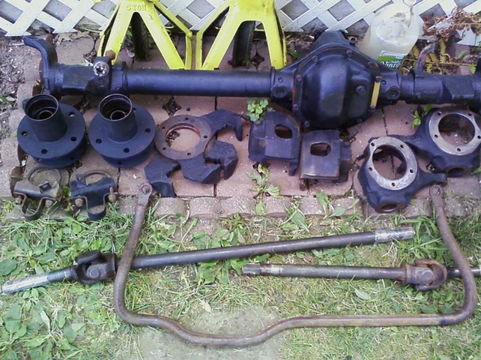 Spindles, hubs, rotors, calipers, and brake mounting brackets.