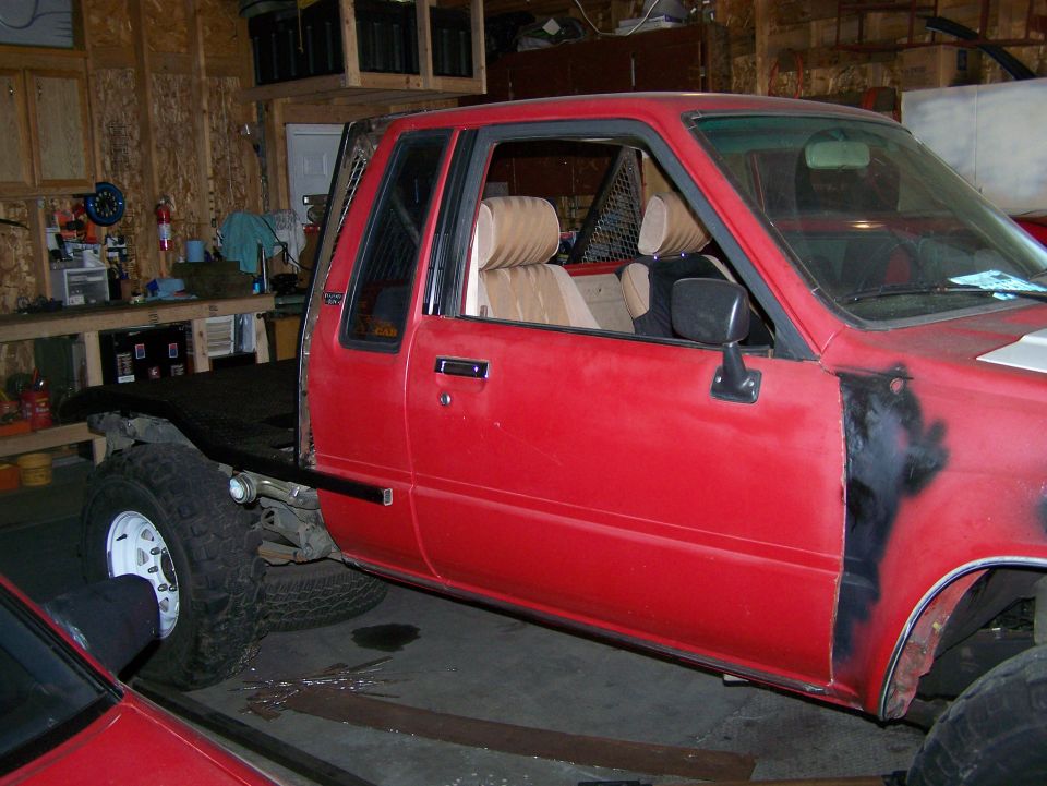 Red flatbed truck side view, interior visible