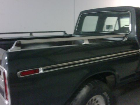 1979 Ford F-250 - This 1979 Ford F-250 Crewcab pickup truck is shown from the side, highlighting its bed rails and taillight.