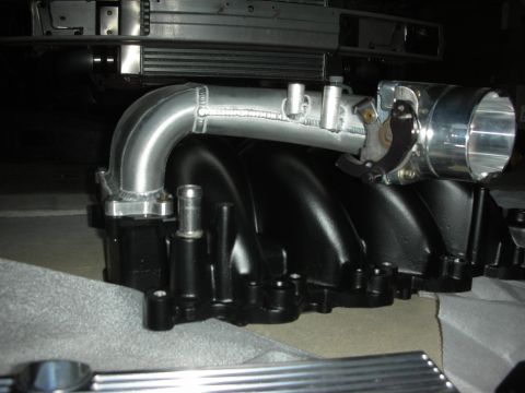 1992 Ford Crown Victoria - Aftermarket intake manifold and throttle body assembly, likely for performance engine modification.