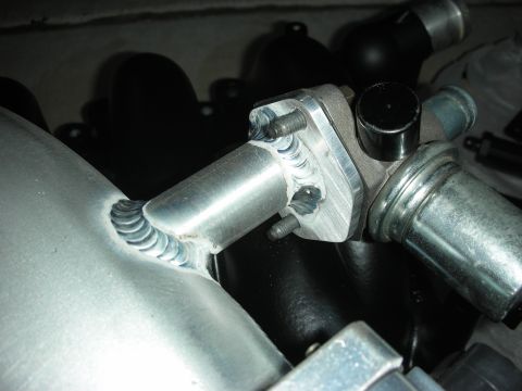 1992 Ford Crown Victoria - Close-up of a custom-welded engine component, likely for performance modification.