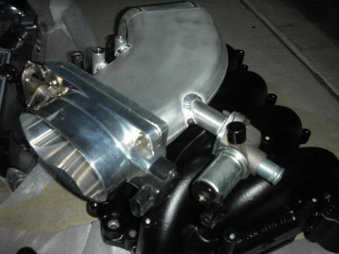 1992 Ford Crown Victoria - Close-up of an aftermarket intake manifold and throttle body, likely for engine performance modification.