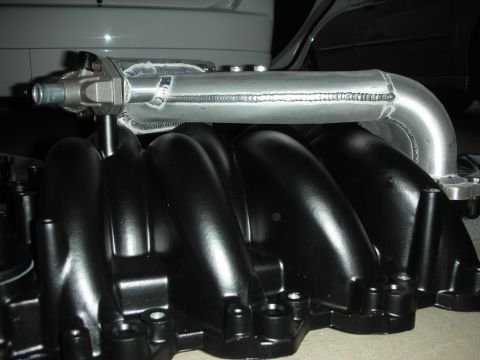 1992 Ford Crown Victoria - Aftermarket intake manifold with black runners and silver tubing, likely for a performance engine build.