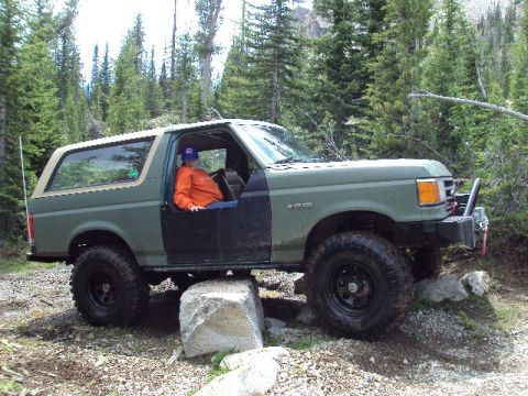 1989 Ford Bronco - This 1989 Ford Bronco navigates a challenging off-road course with large rocks.