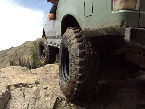 1989 Ford Bronco - This lifted Ford Bronco navigates a rocky mountain trail.