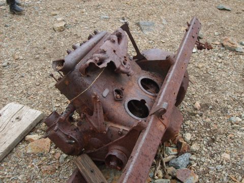 1989 Ford Bronco - This heavily rusted engine block and frame components suggest a vehicle that has been abandoned for a significant period.