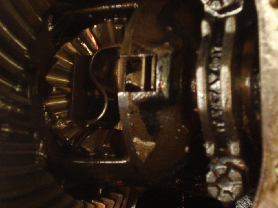 Differential gears with a ring gear and pinion visible, close-up