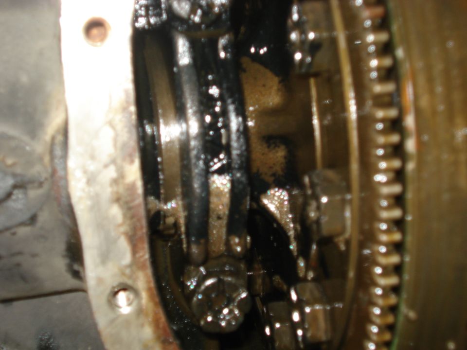 Close-up of internal differential gears and housing, showing wear and grease