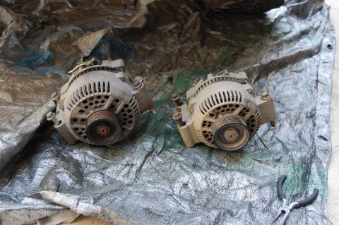 1994 Ford Bronco - Stock 95 amp 3G on the right. 130 amp 3G on the left. came from a cash for clunkers explorer. I saved the terminal boot for the new charge…