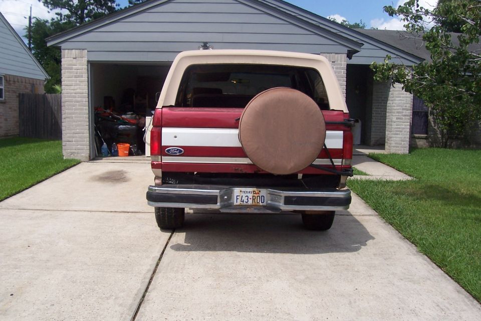 1988 Ford Bronco rear view with spare tire cover and Texas license plate F43-RDO