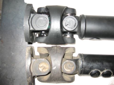 1995 Ford Bronco - A close-up view shows a comparison between two driveshafts and their universal joints.