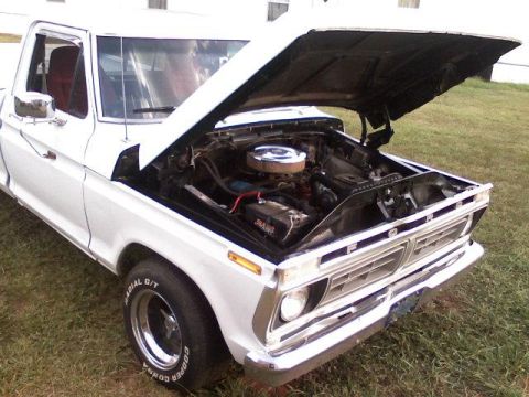 1995 Ford Bronco - White 1977 Ford F-series pickup truck with hood open, revealing the engine bay.