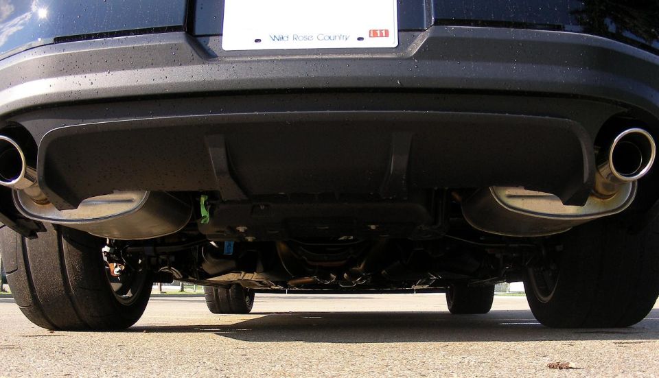 2011 Ford Mustang rear underside with dual exhaust pipes and wide tires