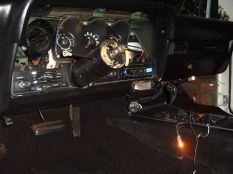 1973 Ford Ranchero - The interior of a vehicle shows a disassembled dashboard with exposed wiring and components.