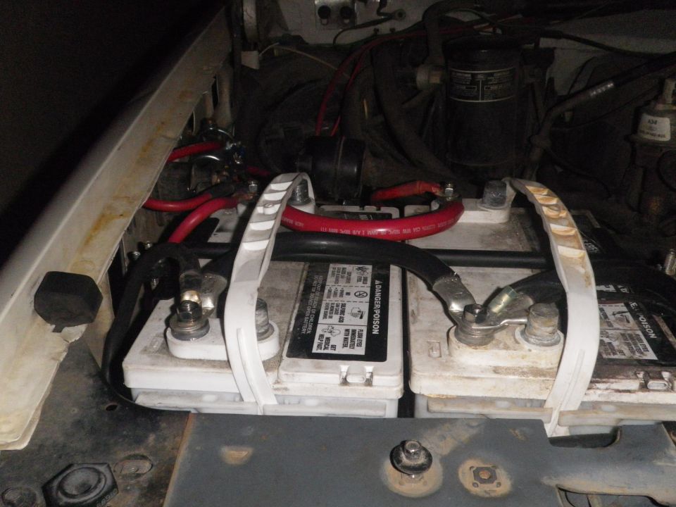 Dual batteries in engine bay with red cables